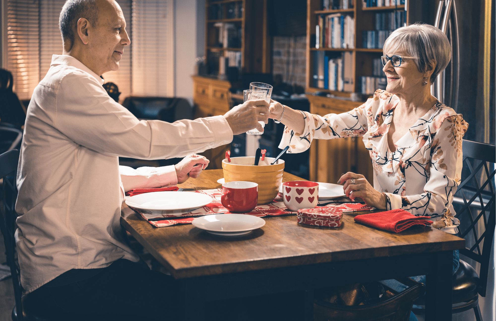 Senior couple enjoying Valentines Day themed dinner