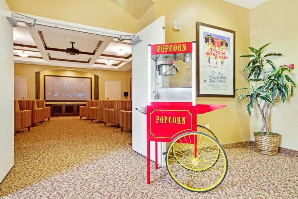 A beautiful private movie theater with popcorn machine at The Oaks.