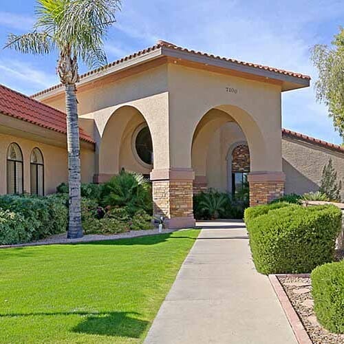 Copper Creek Senior Living South Jordan Utah front entrance at sunset