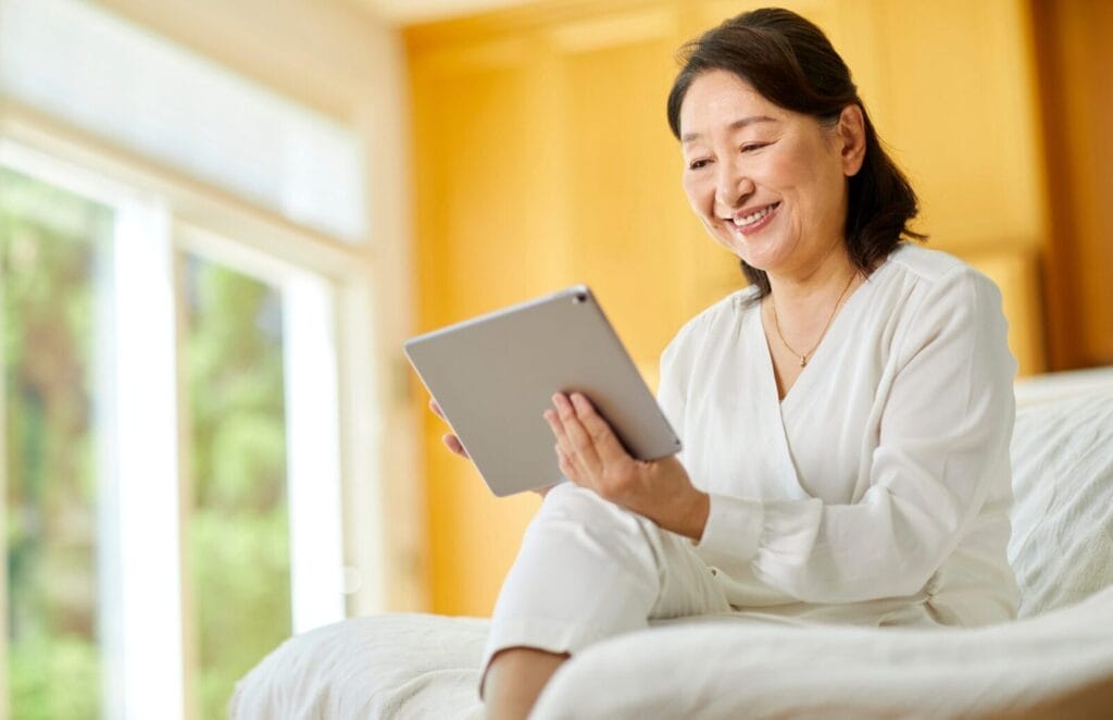 Woman looking at an iPad.