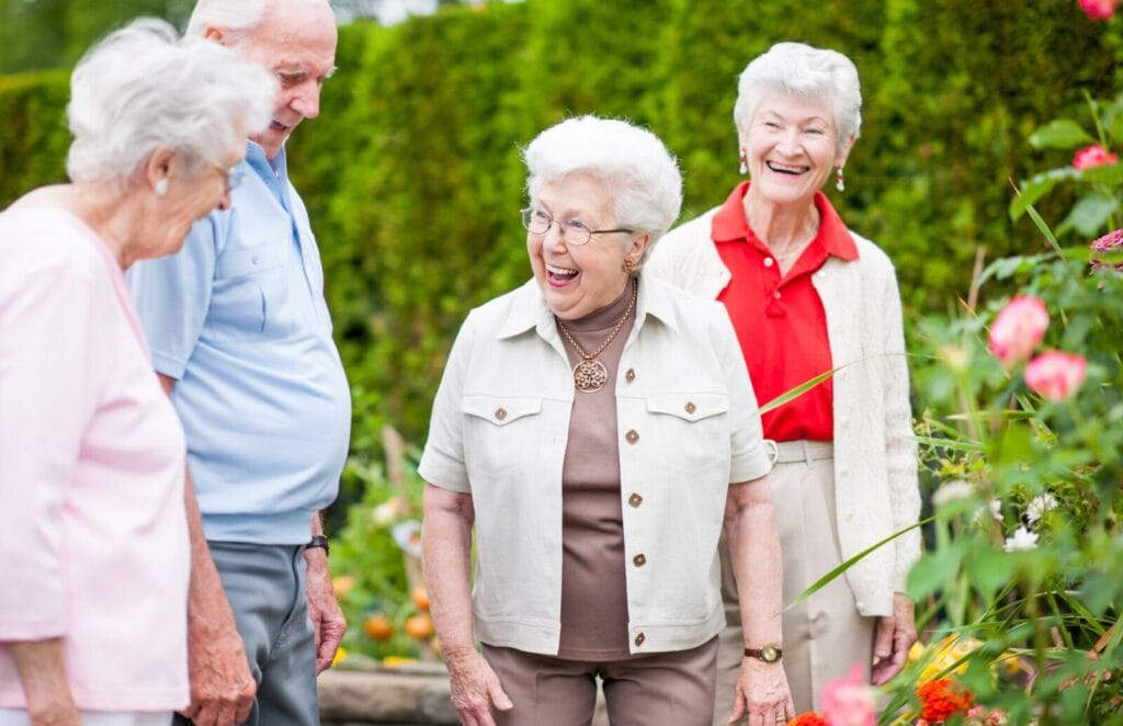 Seniors enjoy the courtyard at their community.