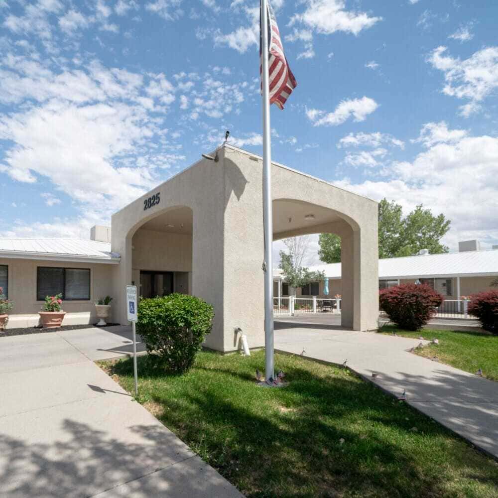 Mantey-Heights1 Copper Creek Senior Living South Jordan Utah front entrance at sunset