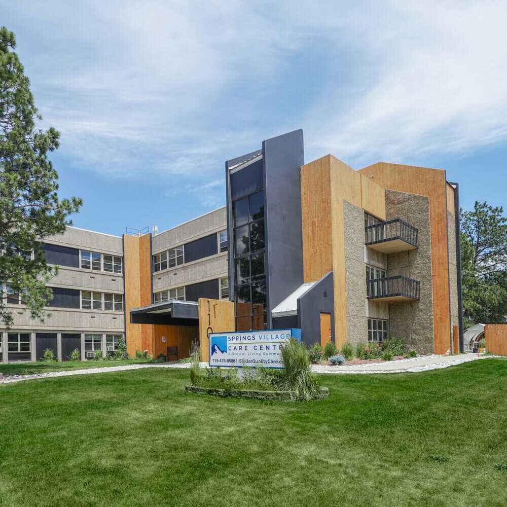 Springs-Village1 (1) Copper Creek Senior Living South Jordan Utah front entrance at sunset