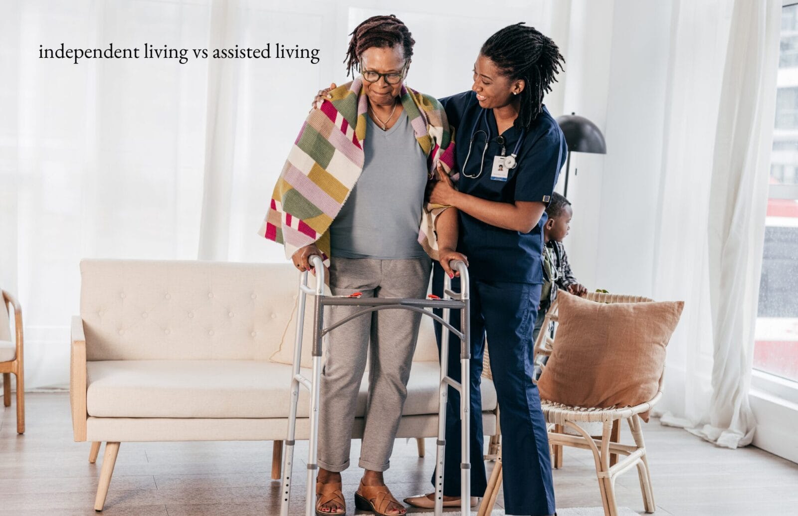 independent v assisted living 1 A caregiver helps a senior stand with a walker.