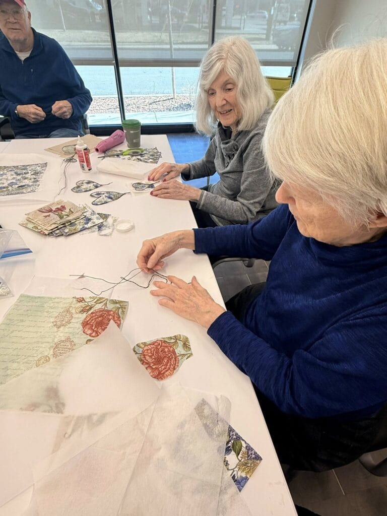 Seniors in Denver making fabric hearts.