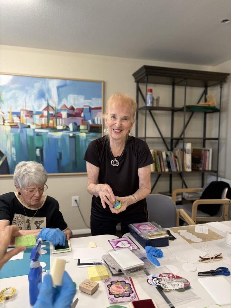 Senior living residents enjoying a craft project