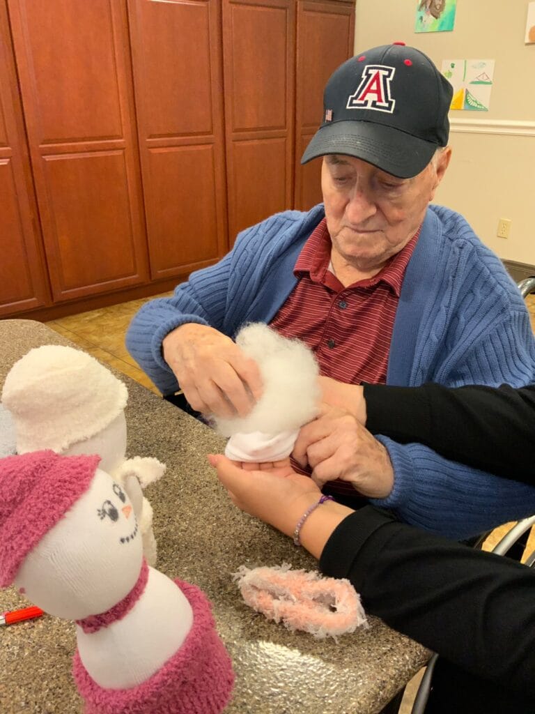 Seniors making sock snowmen