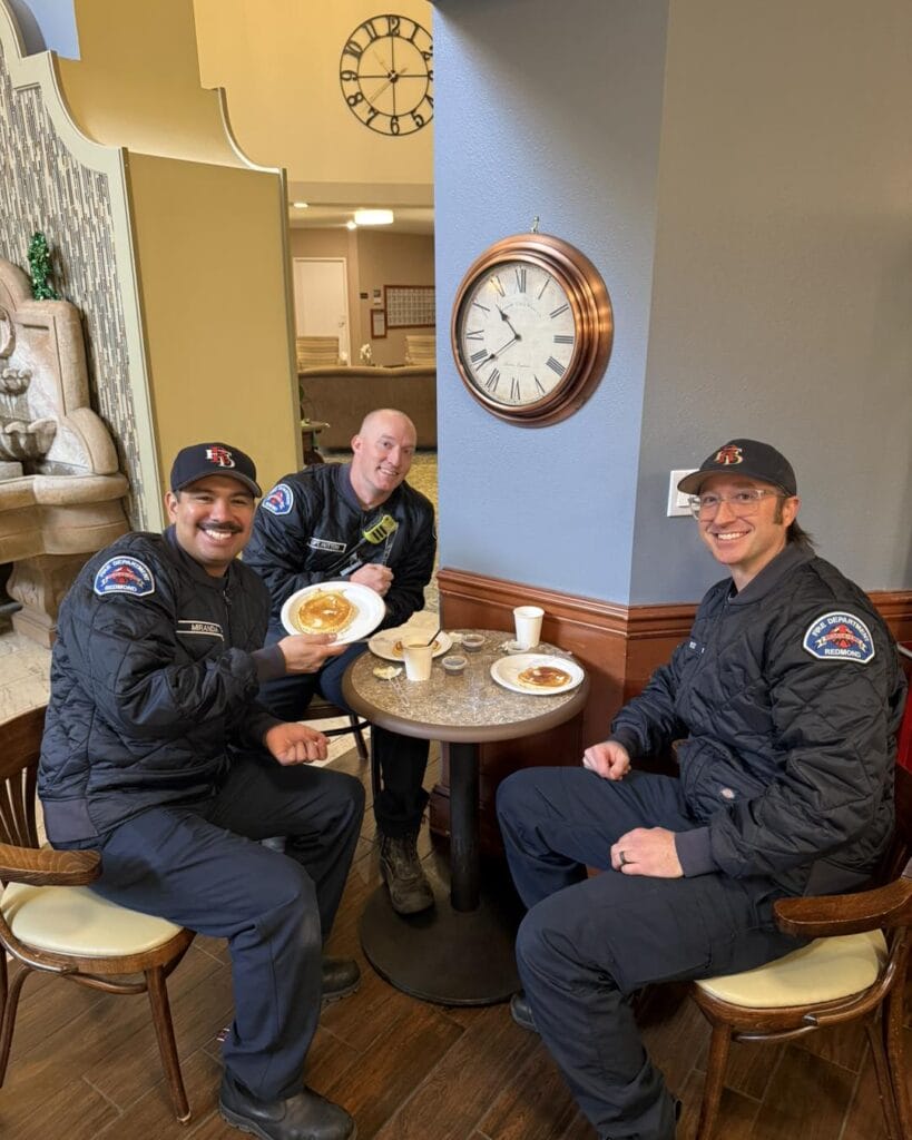 Firefighters eating pancakes