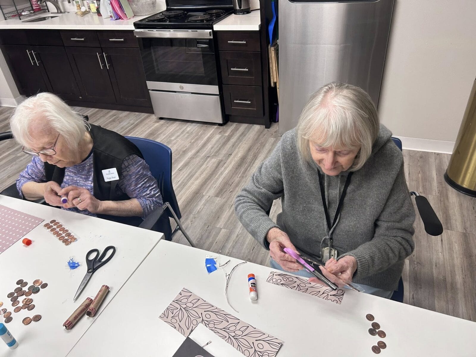 Seniors making a penny craft