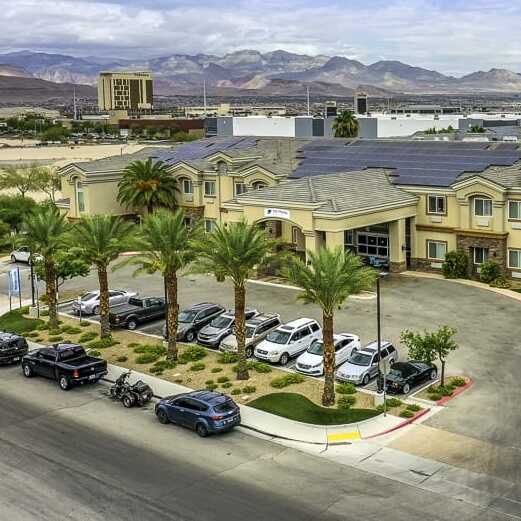 Copper Creek Senior Living South Jordan Utah front entrance at sunset