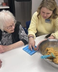 A staff member helps a resident at Overlake Terrace Assisted Living in Redmond