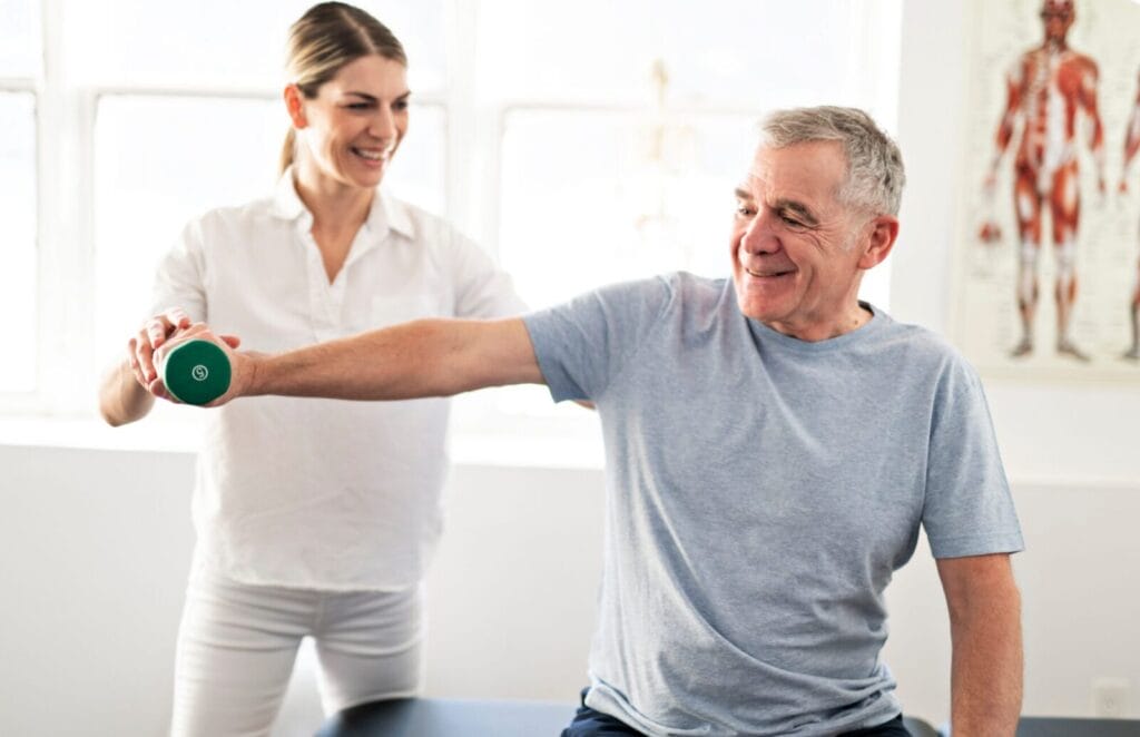 A physical therapist performs rehab exercises