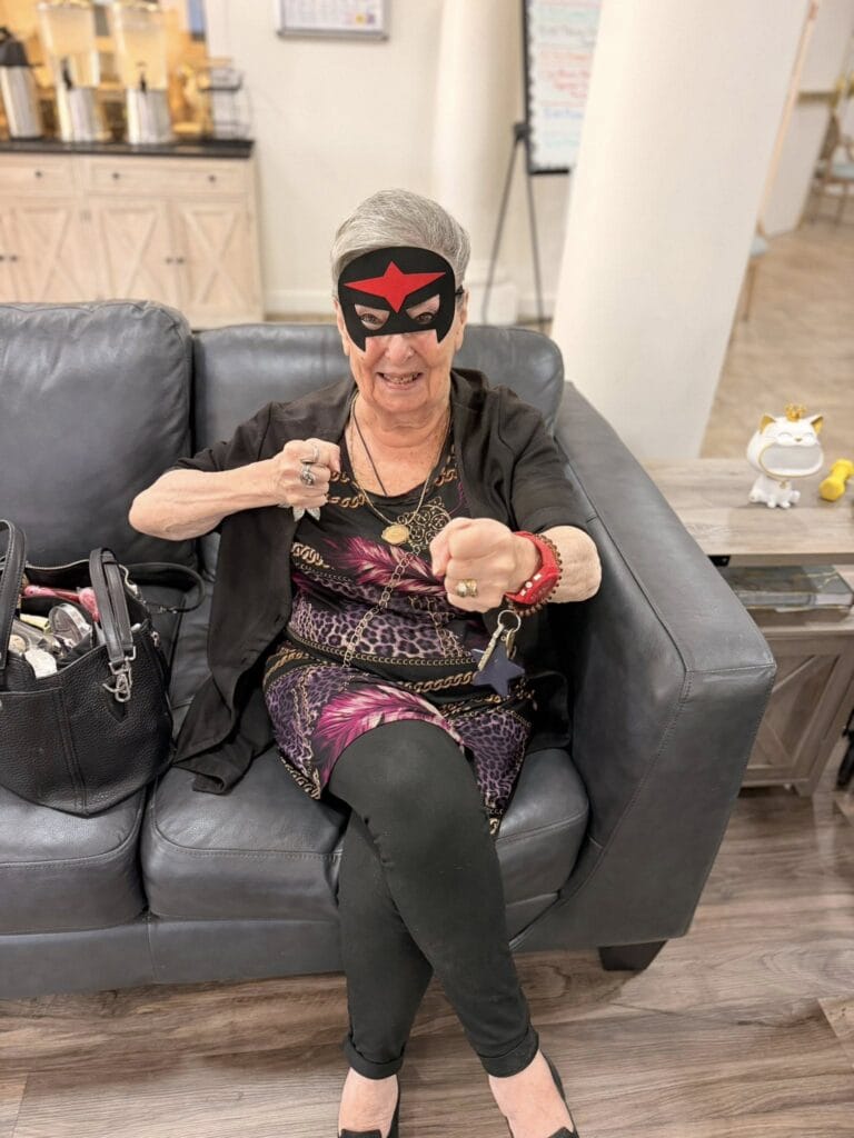 A senior enjoys costume day at The Forum at Desert Harbor in Peoria, Arizona