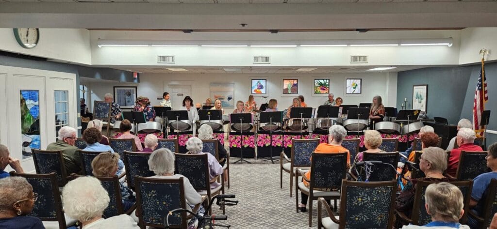 Seniors at The Forum at Desert Harbor in Peoria, Arizona enjoy a musical performance